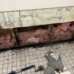  Tile and wall repair at a Housing Authority.